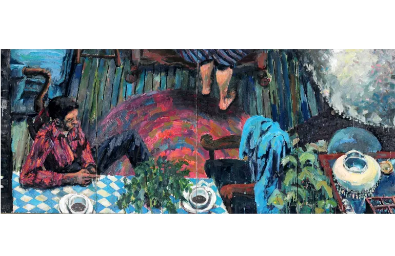 Seated woman in red plaid shirt, colorful patterned rug, and blue tablecloth.