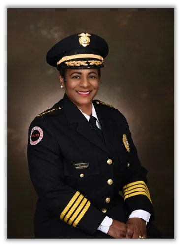 Chief of Police Debra A. Williams in uniform with a police captain's hat.
