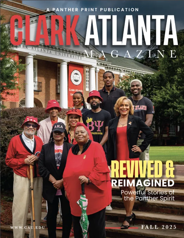 Group stands smiling in front of a red-brick building, wearing red and black outfits.