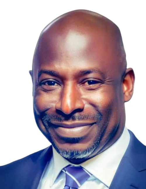 Bald man smiling in a suit and tie against a white background.
