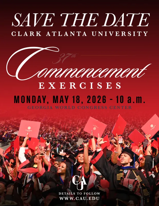 Graduates celebrating with red caps and gowns in a crowded venue.