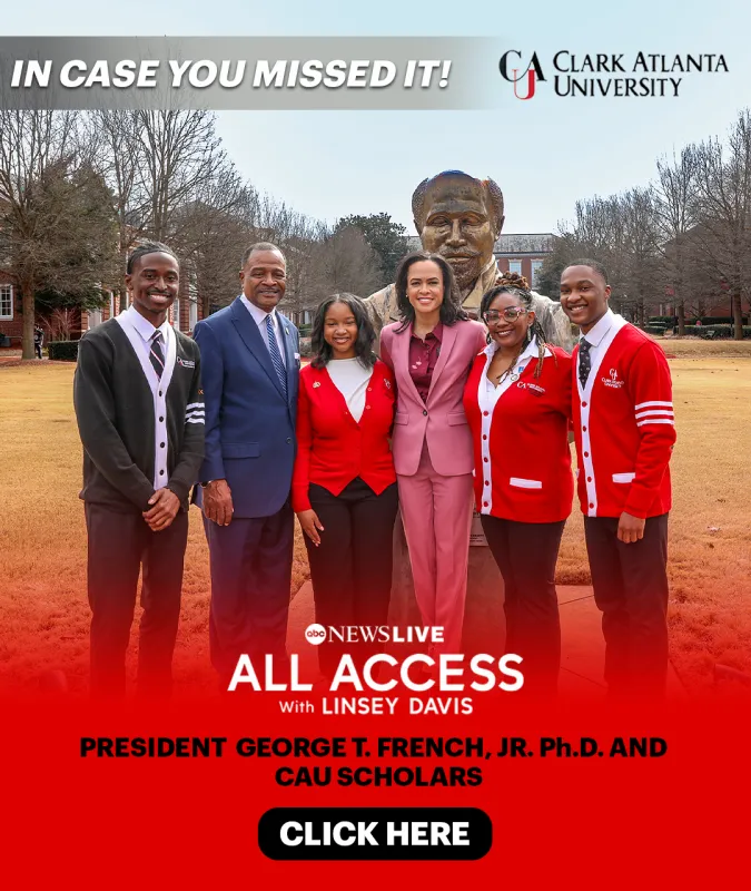 A group of six people smiling, standing on campus with a statue behind them.