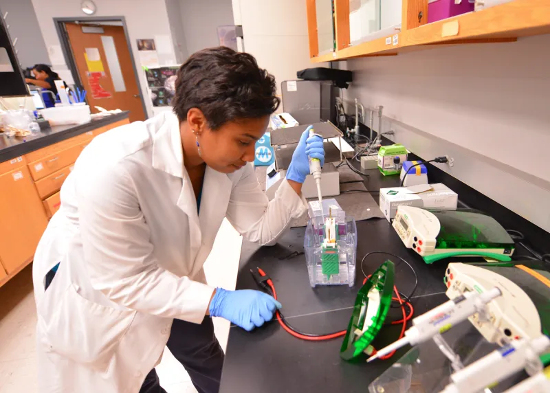 woman in lab doing STEM research